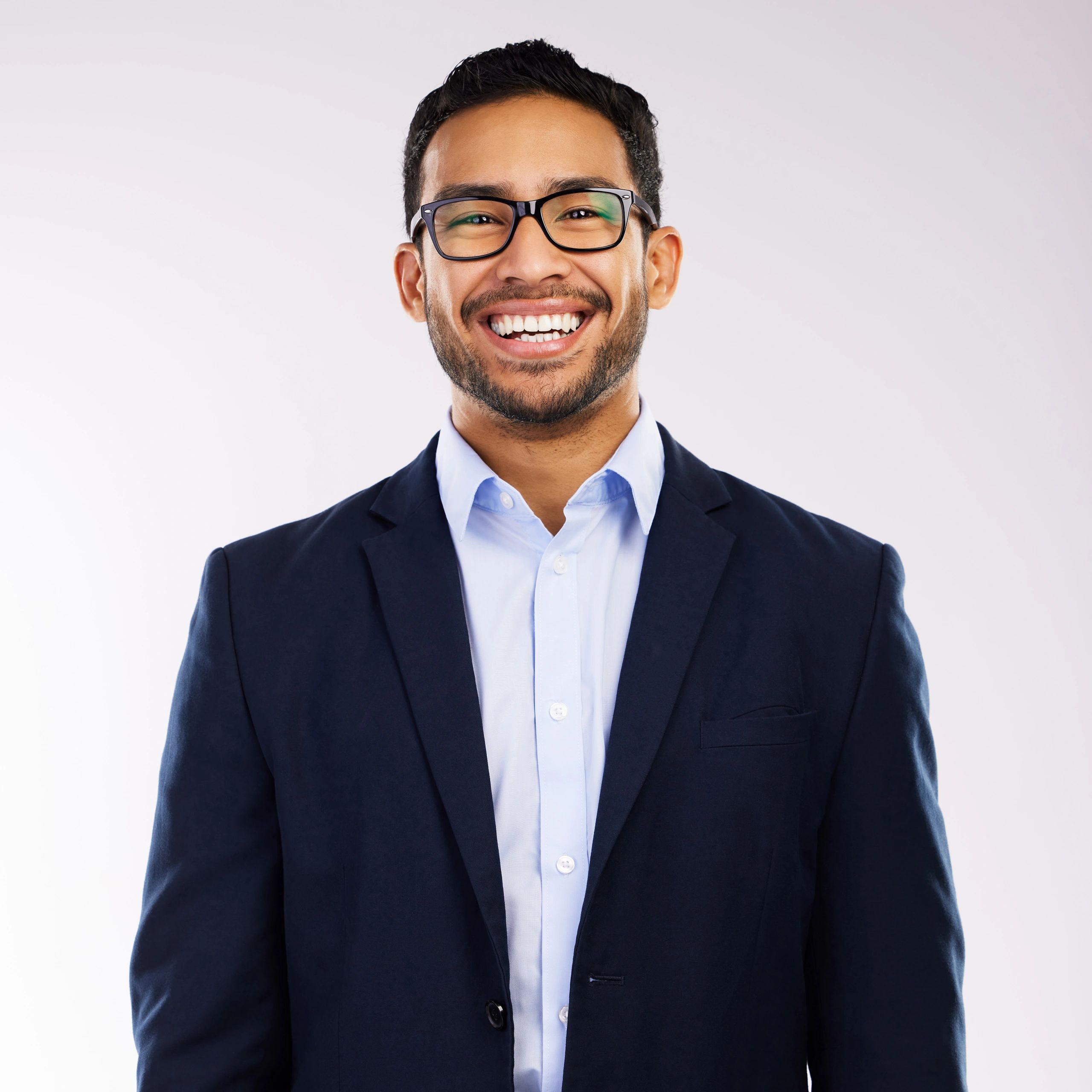 Professional headshot of a business man on a neutral background