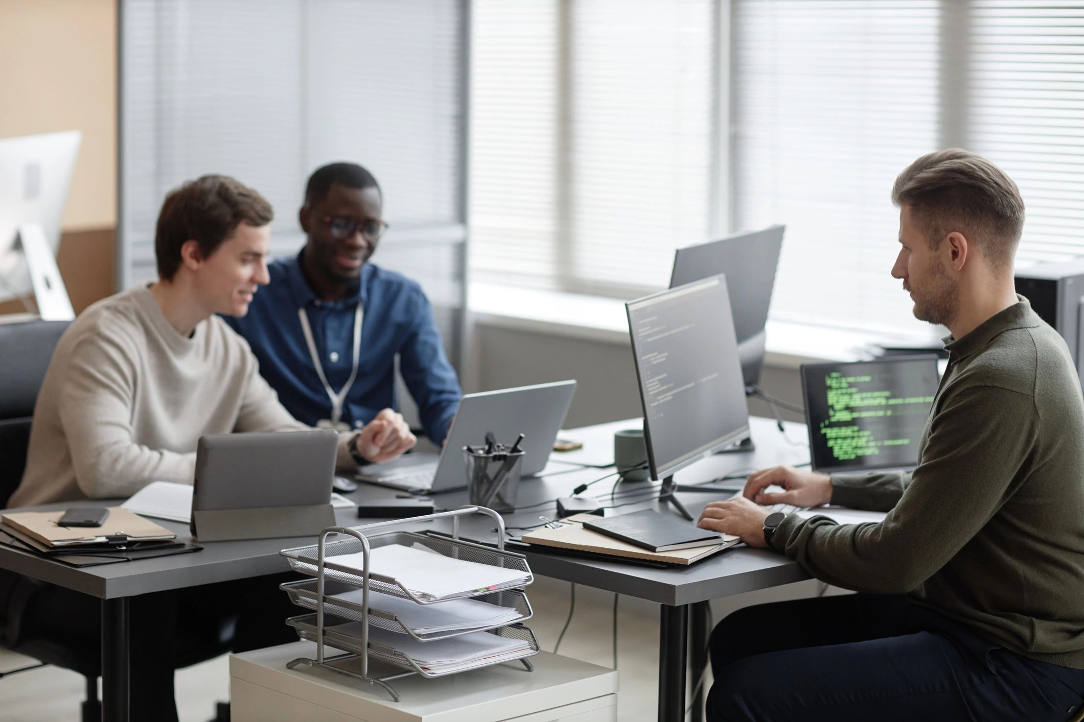 Software team collaborating in a modern office